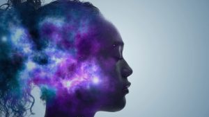 Profile of a woman whose head is filled with a purple starry galaxy, representing the inner journey of ibogaine