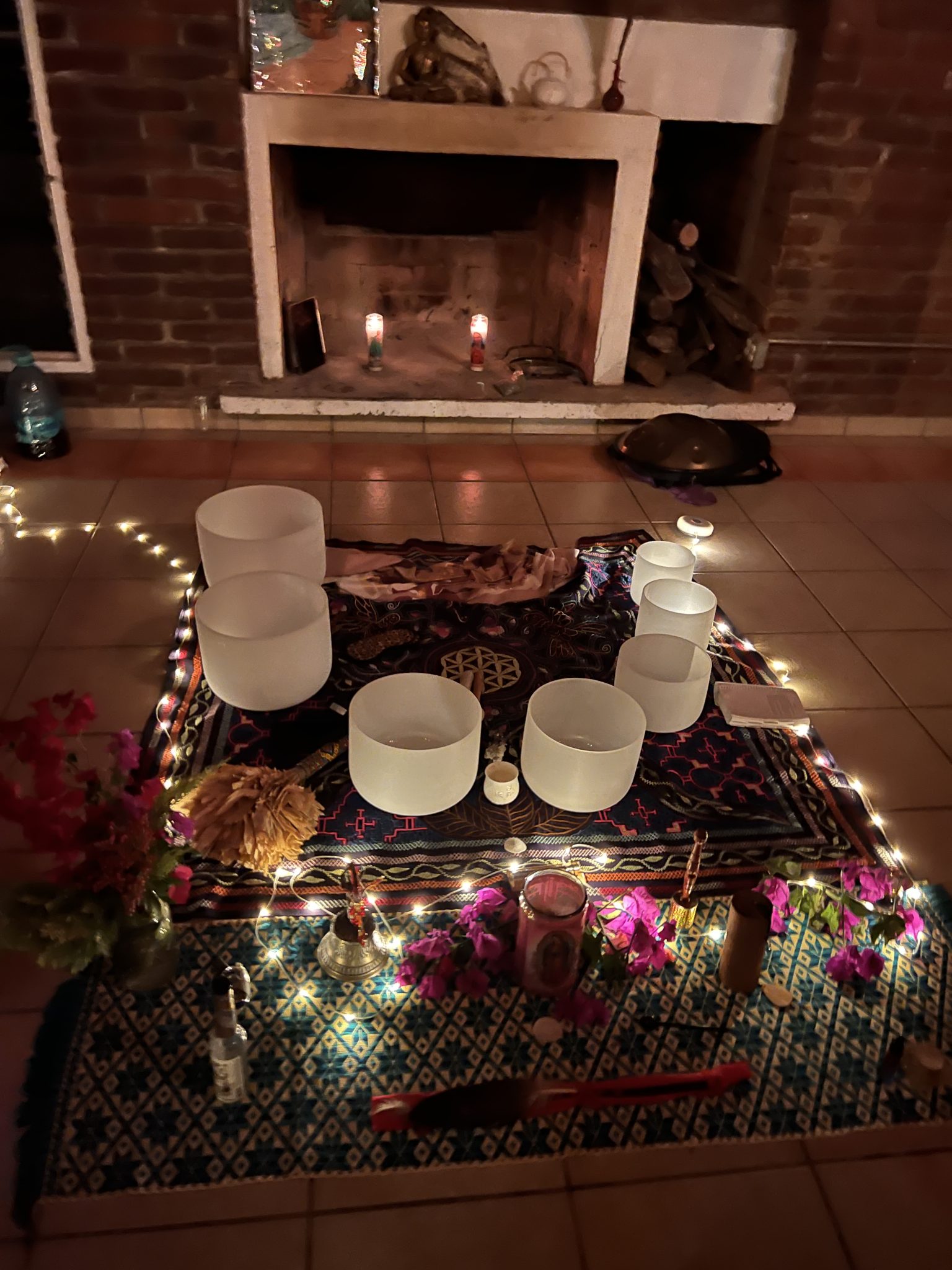 Crystal singing bowls by the fireplace at Iboga Treatment Center