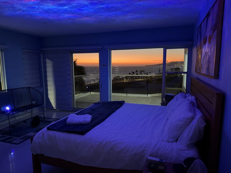 Guest bedroom with sunset views at Iboga Treatment Center in Ensenada, Mexico
