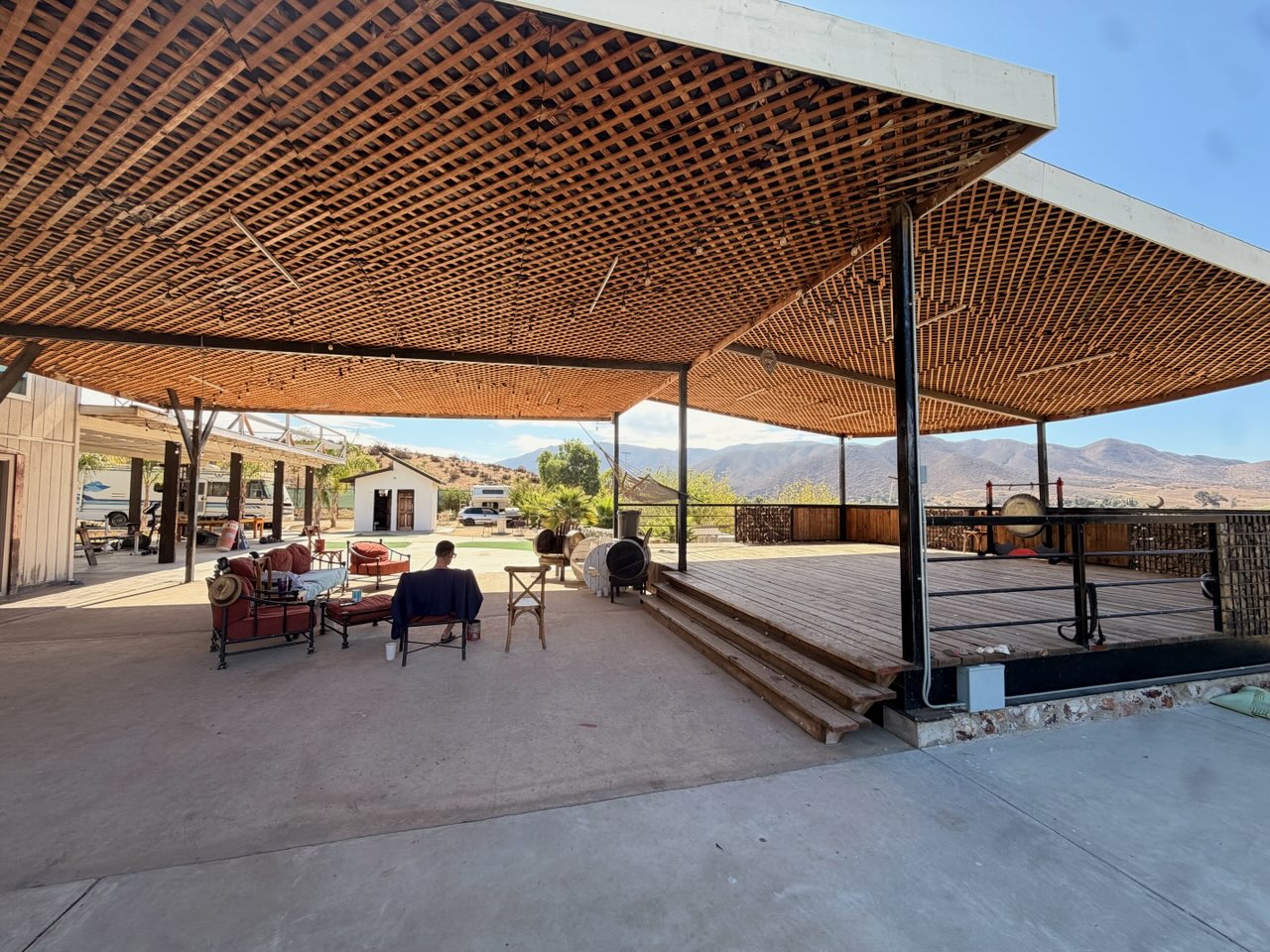 Shaded outdoor lounge with mountain views at Iboga Treatment Center in Ensenada, Mexico