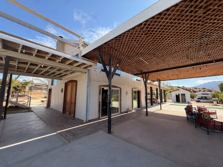 Main building and shaded walkway at Iboga Treatment Center in Ensenada, Mexico